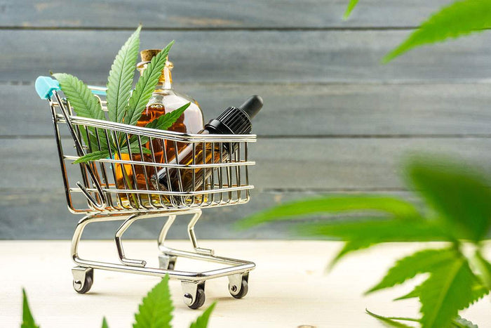 a shopping cart full of essential oils